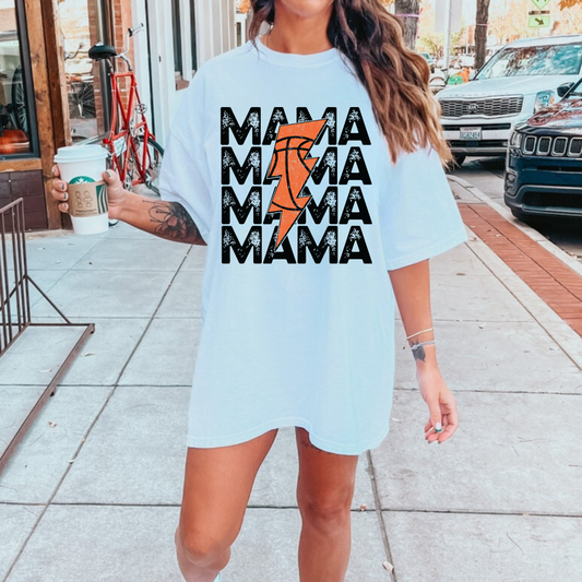 An oversized comfort colors t-shirt for basketball mamas featuring a retro basketball and lightning bolt design. This basketball mom shirt is ideal for game day, offering a stylish and comfortable outfit choice with a vintage-inspired twist.