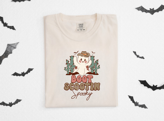 Trendy oversized preppy Western Halloween shirt with "Boot Scootin' Spooky" cowboy design - Embrace the spirit of Western Halloween and autumn with this stylish and playful shirt featuring a ghost cowboy. Perfect blend of retro and trendy fashion for your fall festivities.