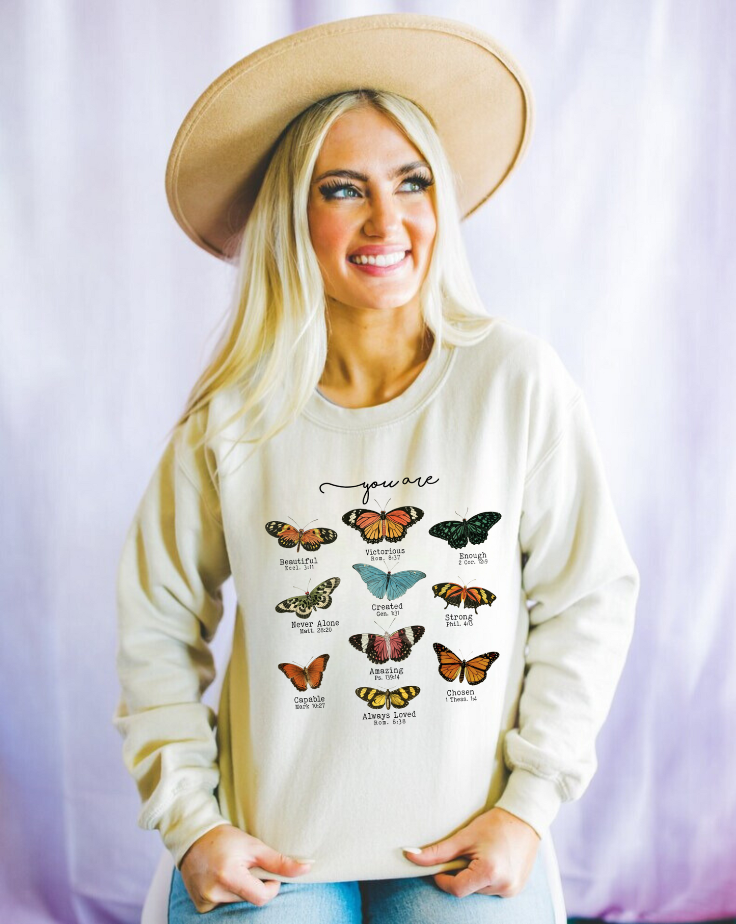 Christian crewneck sweatshirt with butterfly designs and Bible verse quotes.