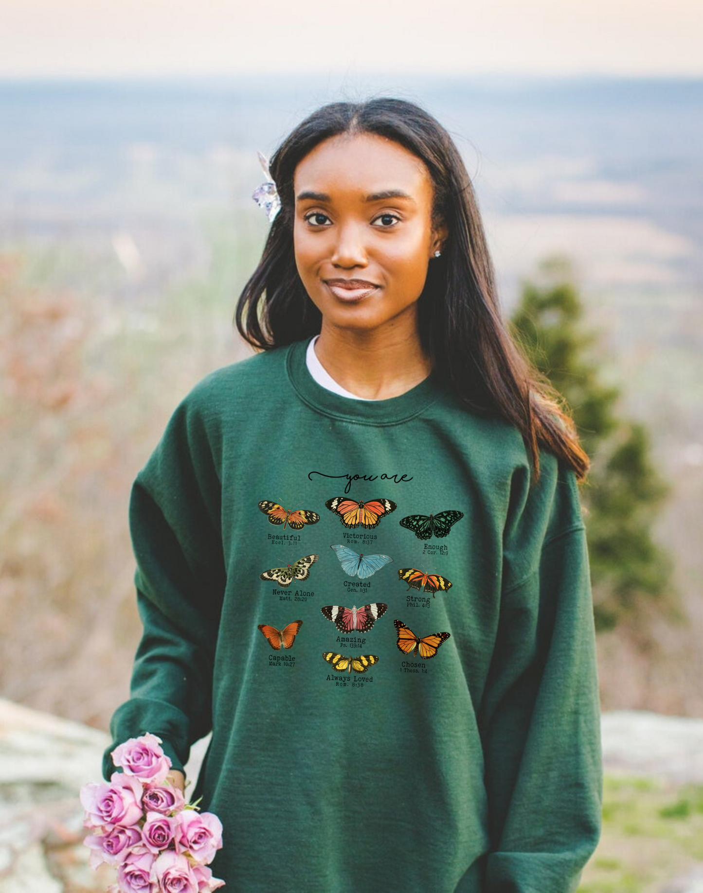 Christian crewneck sweatshirt with butterfly designs and Bible verse quotes.