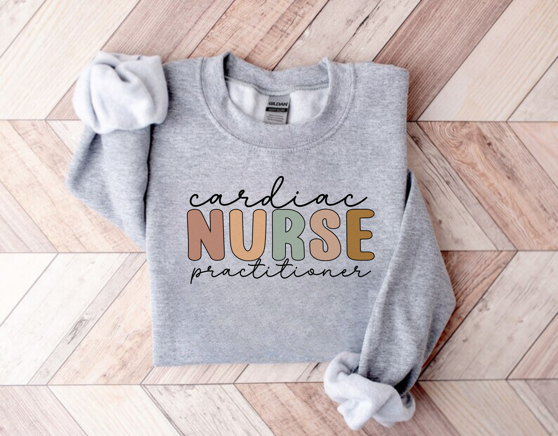 A Cardiac Nurse Practitioner Crewneck Sweatshirt, featuring a stylish and comfortable design. This nurse sweater is tailored for cardiac nurses and nurse practitioners, making it the perfect addition to your nurse work outfit. Showcase your expertise and dedication in cardiac care with this cute nurse sweatshirt. Shop now and elevate your nurse clothes collection with this specialized nurse practitioner apparel.