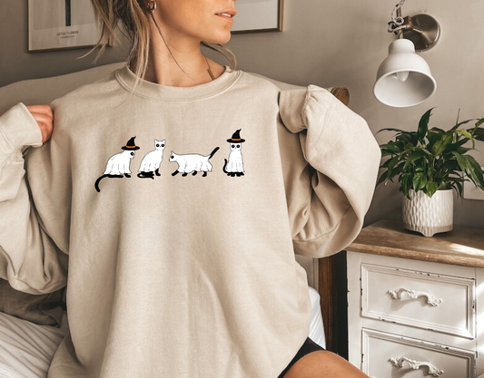 A stylish oversized sweatshirt with a cute and spooky ghost cat design, perfect for Halloween and cat lovers. The black cat ghost adds a touch of whimsy to your fall outfit.