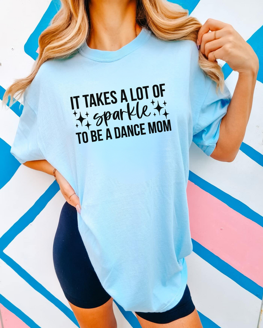 An image of a cute and stylish oversized Dance Mom shirt with a design that represents the pride and enthusiasm of being a dance competition mom. Perfect for joining the dance mom squad or club, this shirt also makes a great gift. The shirt is made of high-quality Comfort Colors fabric and is designed for comfort and style.