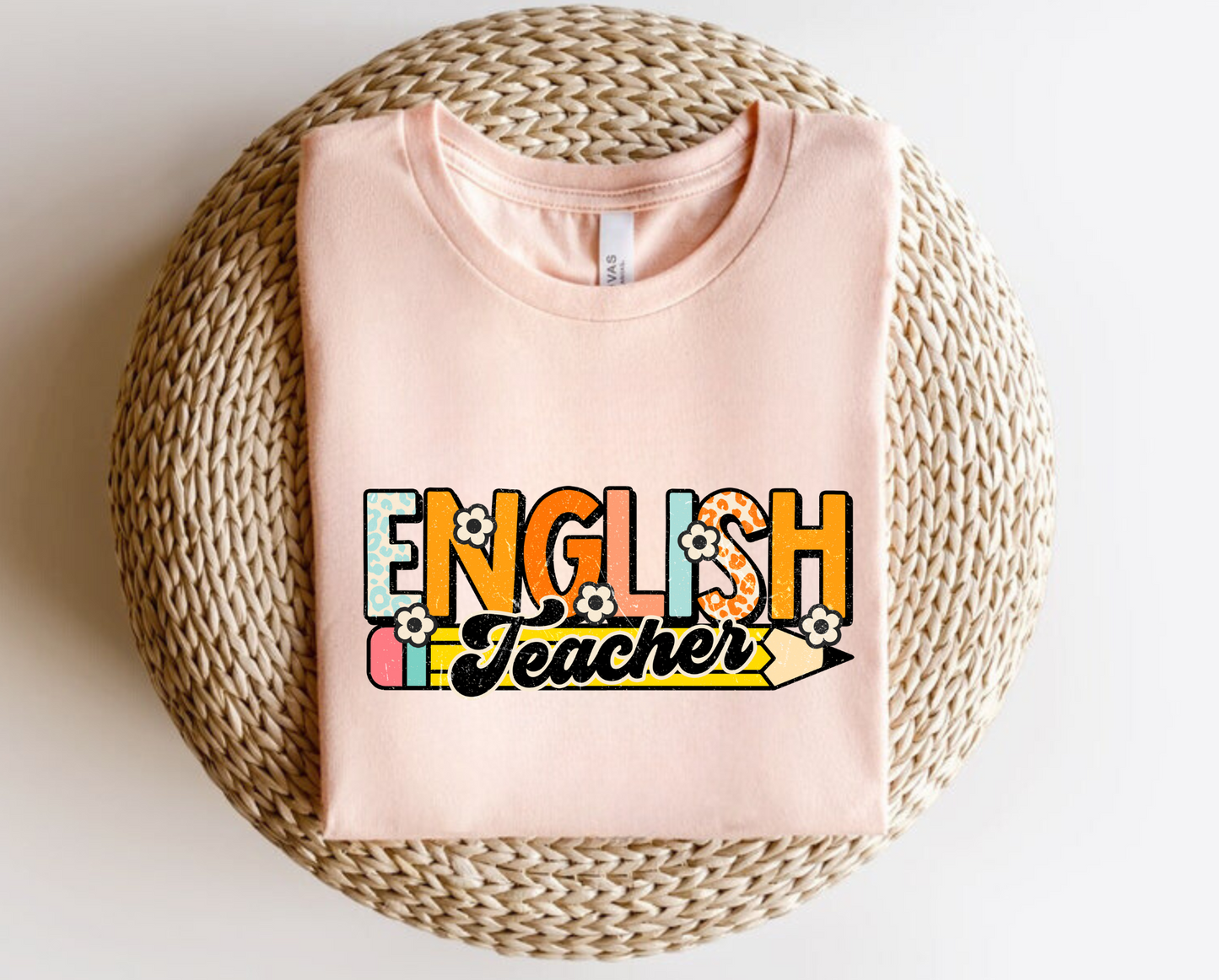  A retro-inspired English teacher shirt with a stylish graphic design. This cute and cool shirt is perfect for English teachers looking to showcase their passion for teaching. Shop now and add this trendy and comfortable graphic tee to your teacher wardrobe.