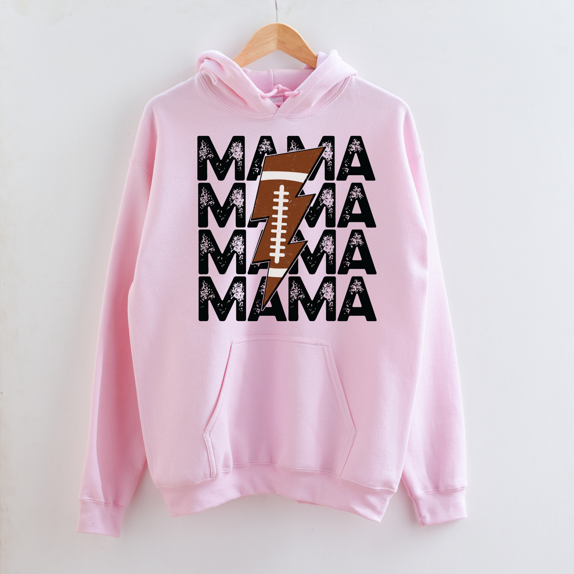 Stay cozy and comfortable while rooting for your football star with our football mom hoodie sweatshirt. Crafted for both comfort and style, this hoodie is the ultimate choice for chilly football game days. Show your support for your athlete while staying warm in this essential hoodie. Stay comfy and stylish as a proud football mama, all while enjoying the excitement of the game!