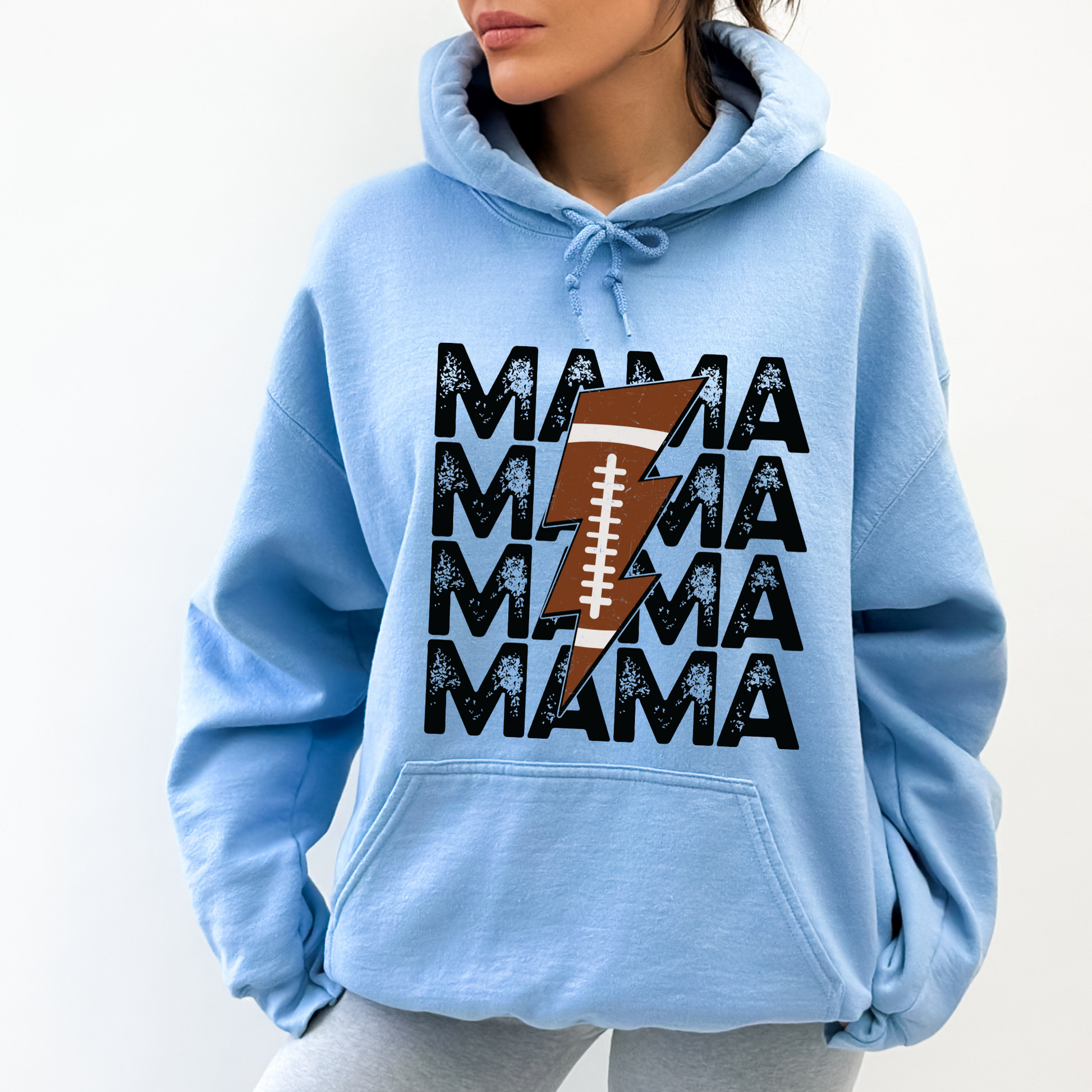 Stay cozy and comfortable while rooting for your football star with our football mom hoodie sweatshirt. Crafted for both comfort and style, this hoodie is the ultimate choice for chilly football game days. Show your support for your athlete while staying warm in this essential hoodie. Stay comfy and stylish as a proud football mama, all while enjoying the excitement of the game!