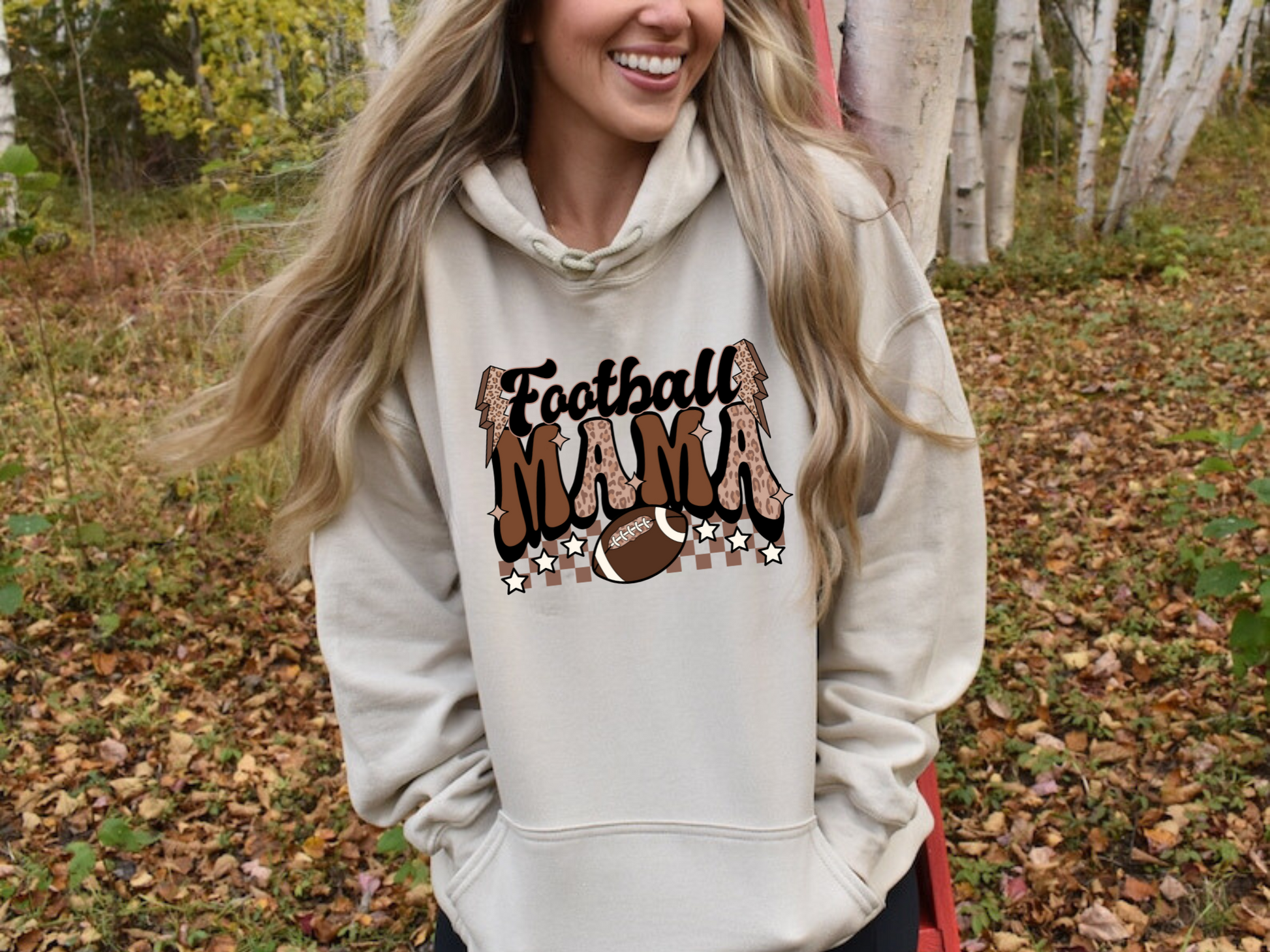 Stay cozy and comfortable while rooting for your football star with our football mom hoodie sweatshirt. Crafted for both comfort and style, this hoodie is the ultimate choice for chilly football game days. Show your support for your athlete while staying warm in this essential hoodie. Stay comfy and stylish as a proud football mama, all while enjoying the excitement of the game!