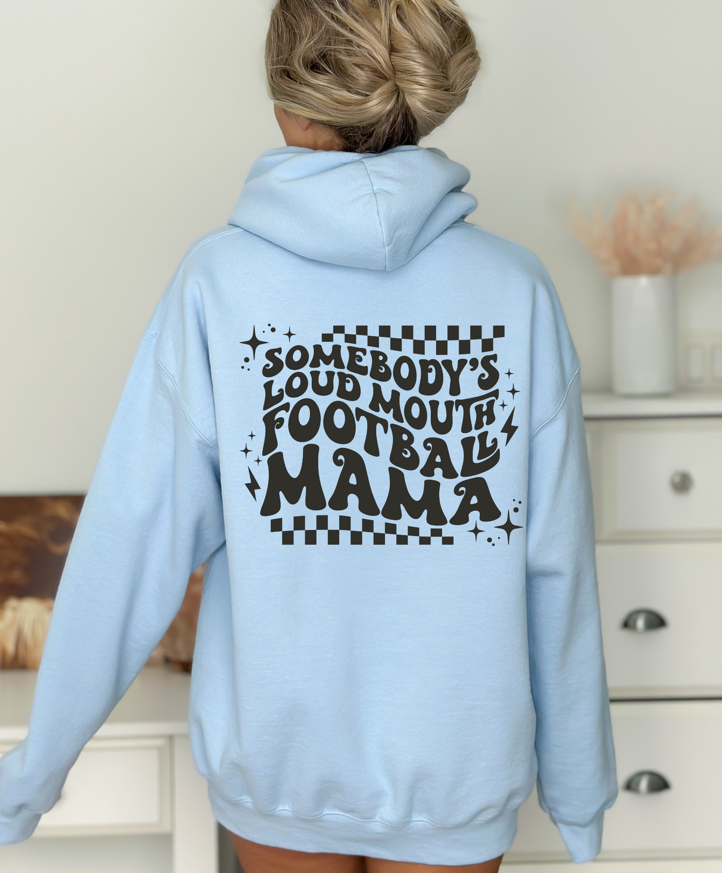 Stay cozy and comfortable while rooting for your football star with our football mom hoodie sweatshirt. Crafted for both comfort and style, this hoodie is the ultimate choice for chilly football game days. Show your support for your athlete while staying warm in this essential hoodie. Stay comfy and stylish as a proud football mama, all while enjoying the excitement of the game!