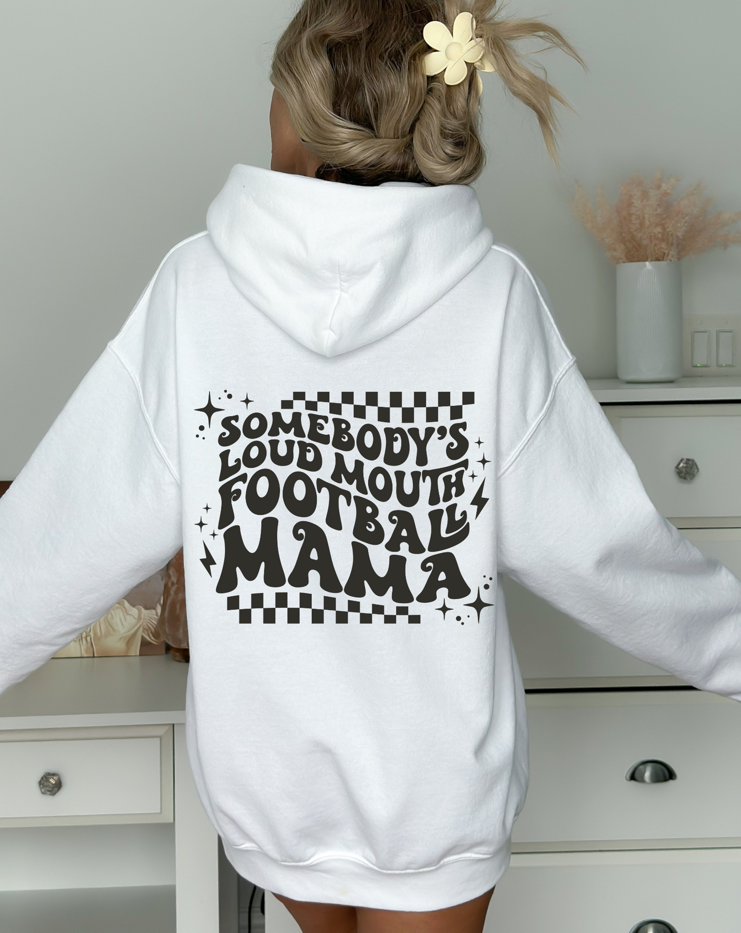 Stay cozy and comfortable while rooting for your football star with our football mom hoodie sweatshirt. Crafted for both comfort and style, this hoodie is the ultimate choice for chilly football game days. Show your support for your athlete while staying warm in this essential hoodie. Stay comfy and stylish as a proud football mama, all while enjoying the excitement of the game!