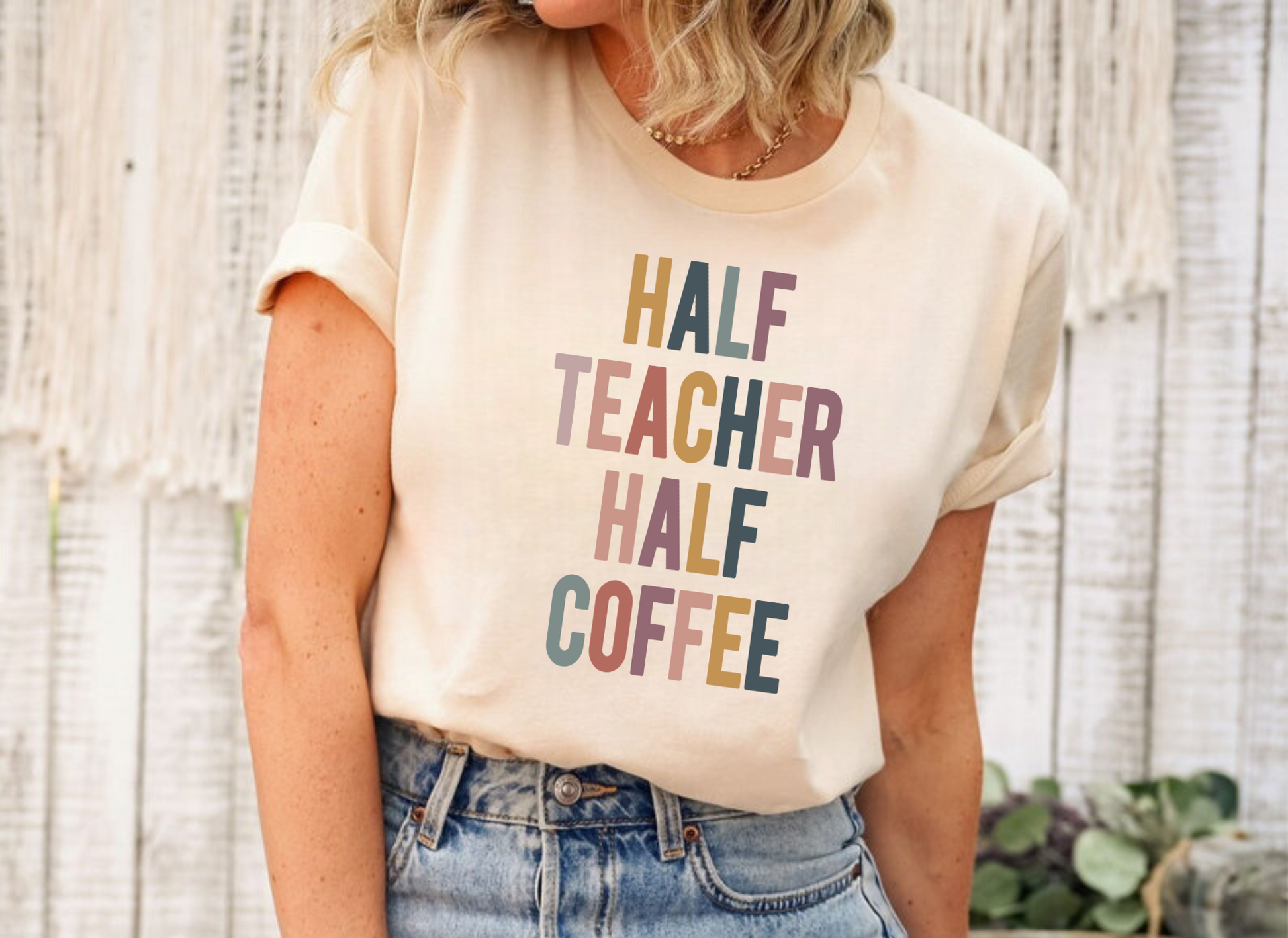 Humorous teacher shirt featuring the phrase 'Half Teacher Half Coffee'