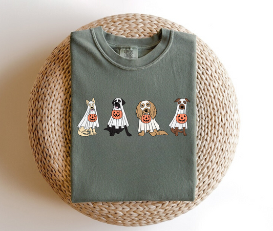 An oversized comfort colors shirt adorned with charming ghost dogs, capturing the essence of a cute and spooky Halloween. Ideal for dog lovers, this trendy shirt brings a touch of autumn to your wardrobe, making it a must-have for the fall season.