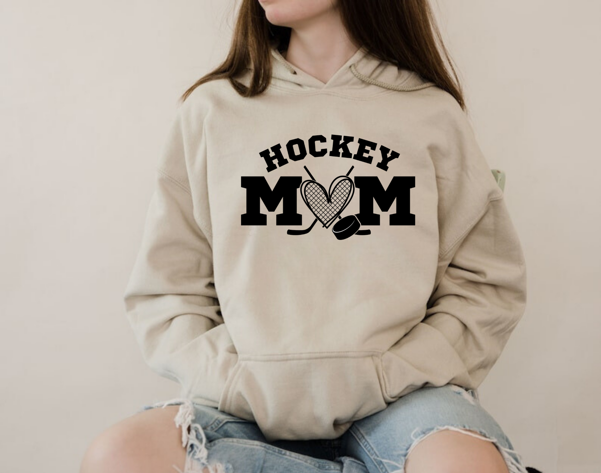 Cozy hockey mom hoodie - Stay warm and stylish on game day with this comfortable sweatshirt designed for hockey moms and hockey mamas. Perfect for supporting players in chilly rinks or cheering from the stands.