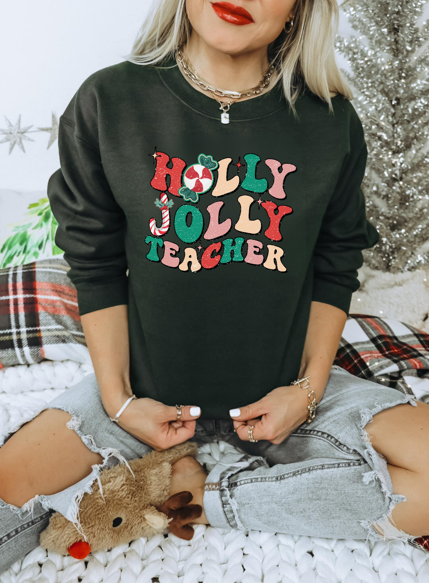 A cute and trendy 'Holly Jolly Teacher' Retro Christmas sweatshirt, perfect for embracing the festive season with a touch of retro charm. The sweater is designed for teachers who want to add holiday cheer to their winter style.