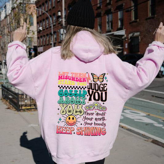 An oversized hoodie with motivational and inspirational quotes on the back that say 'keep shining'. This y2k-inspired hoodie is perfect for self-love and mental health enthusiasts. Shop now and embrace positivity with this cozy and stylish hoodie sweatshirt.