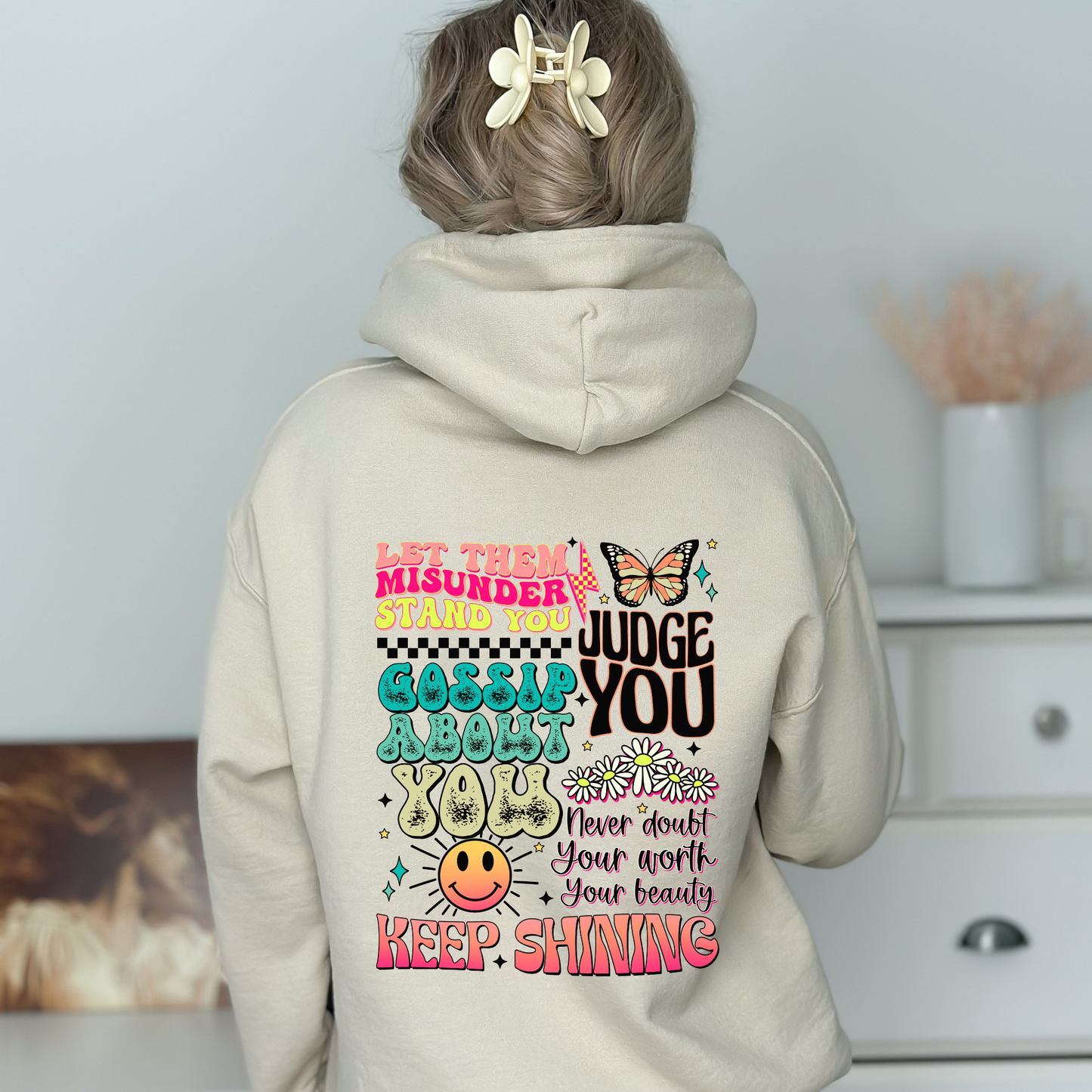 An oversized hoodie with motivational and inspirational quotes on the back that say 'keep shining'. This y2k-inspired hoodie is perfect for self-love and mental health enthusiasts. Shop now and embrace positivity with this cozy and stylish hoodie sweatshirt.