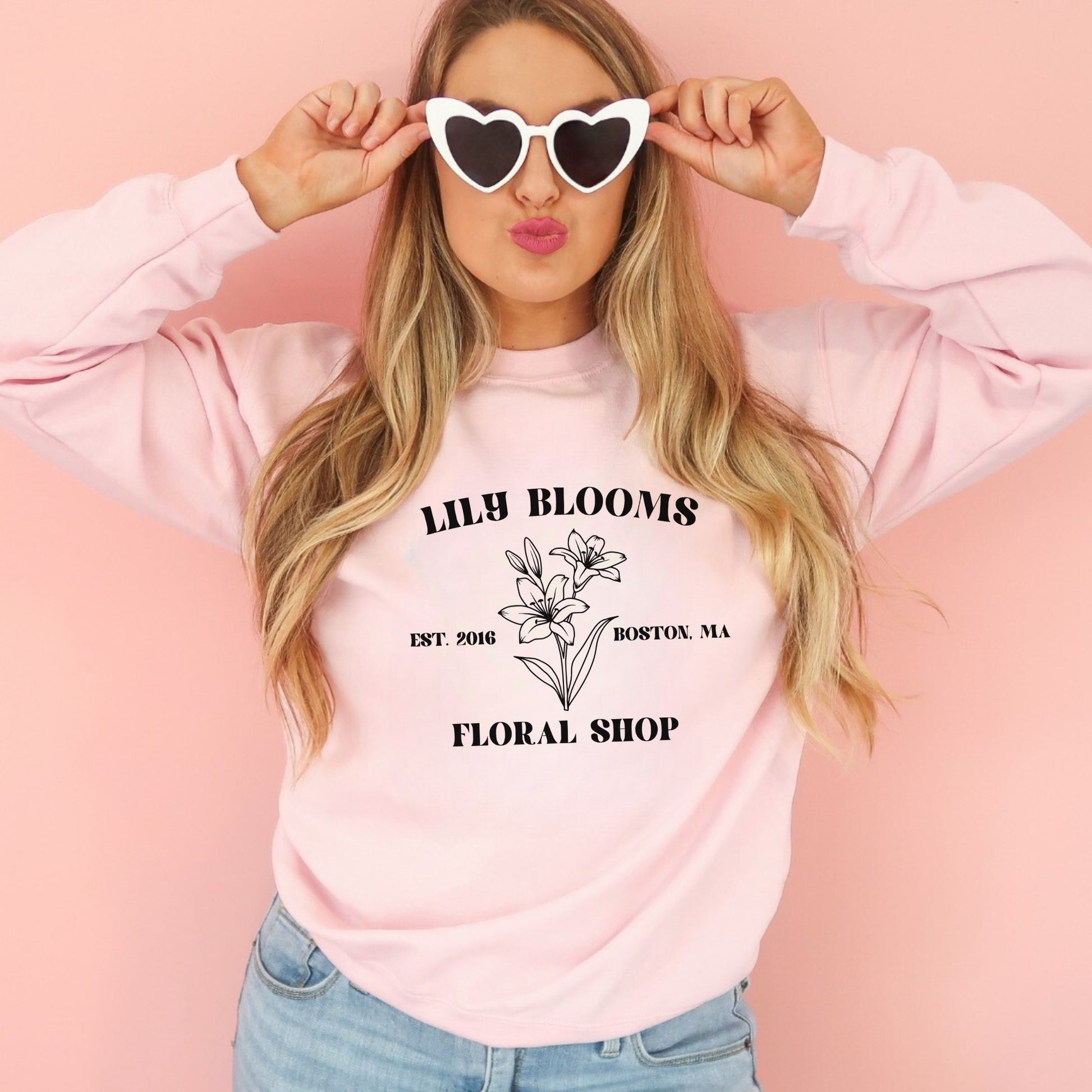 Attention all booktroverts and bookish fashionistas! Show off your love for spicy books and the hit novel "It Ends with Us" with our "Lily Blooms Flower Shop" crewneck sweatshirt. Whether you're curling up with a good book or showing off your love for literature on Booktok, our "Lily Blooms Flower Shop" sweatshirt is the perfect choice. And with its playful nod to the popular novel "It Ends with Us", it's sure to catch the eye of fellow book lovers everywhere.