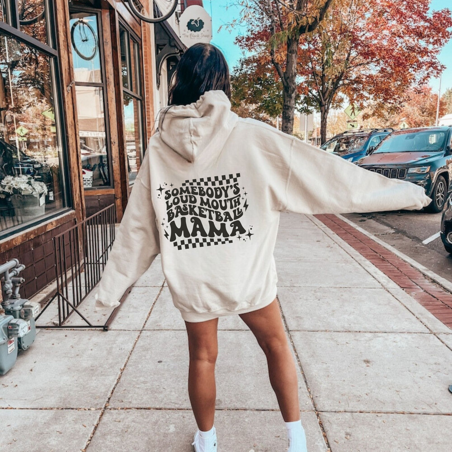 'Somebody's Loud Mouth Basketball Mama" hoodie sweatshirt.  This sweatshirt is ideal for game day, offering comfort and style for basketball moms supporting their players.