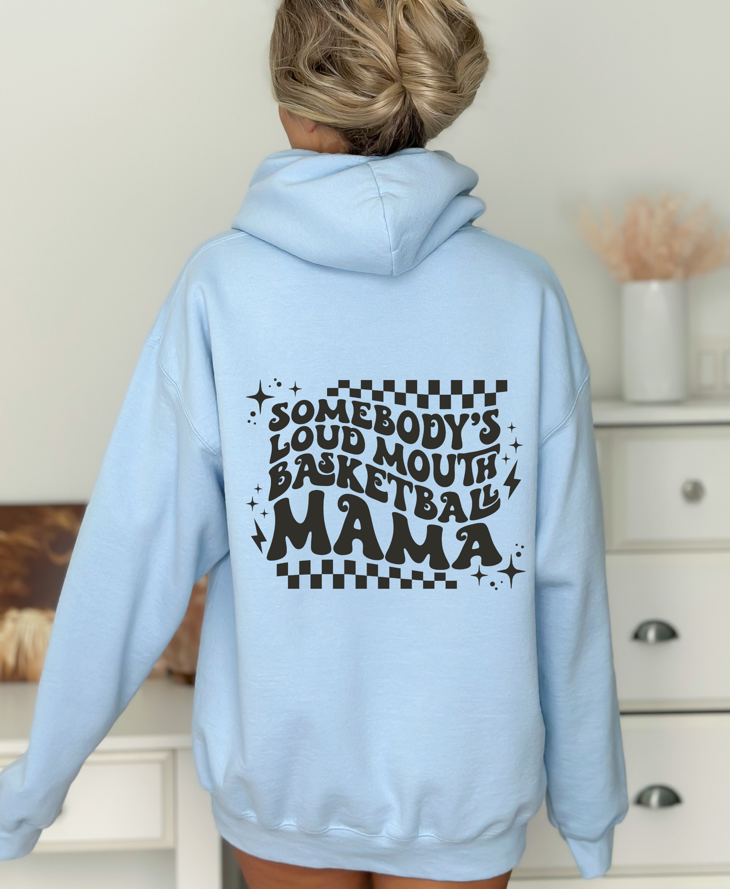 'Somebody's Loud Mouth Basketball Mama" hoodie sweatshirt. This sweatshirt is ideal for game day, offering comfort and style for basketball moms supporting their players.