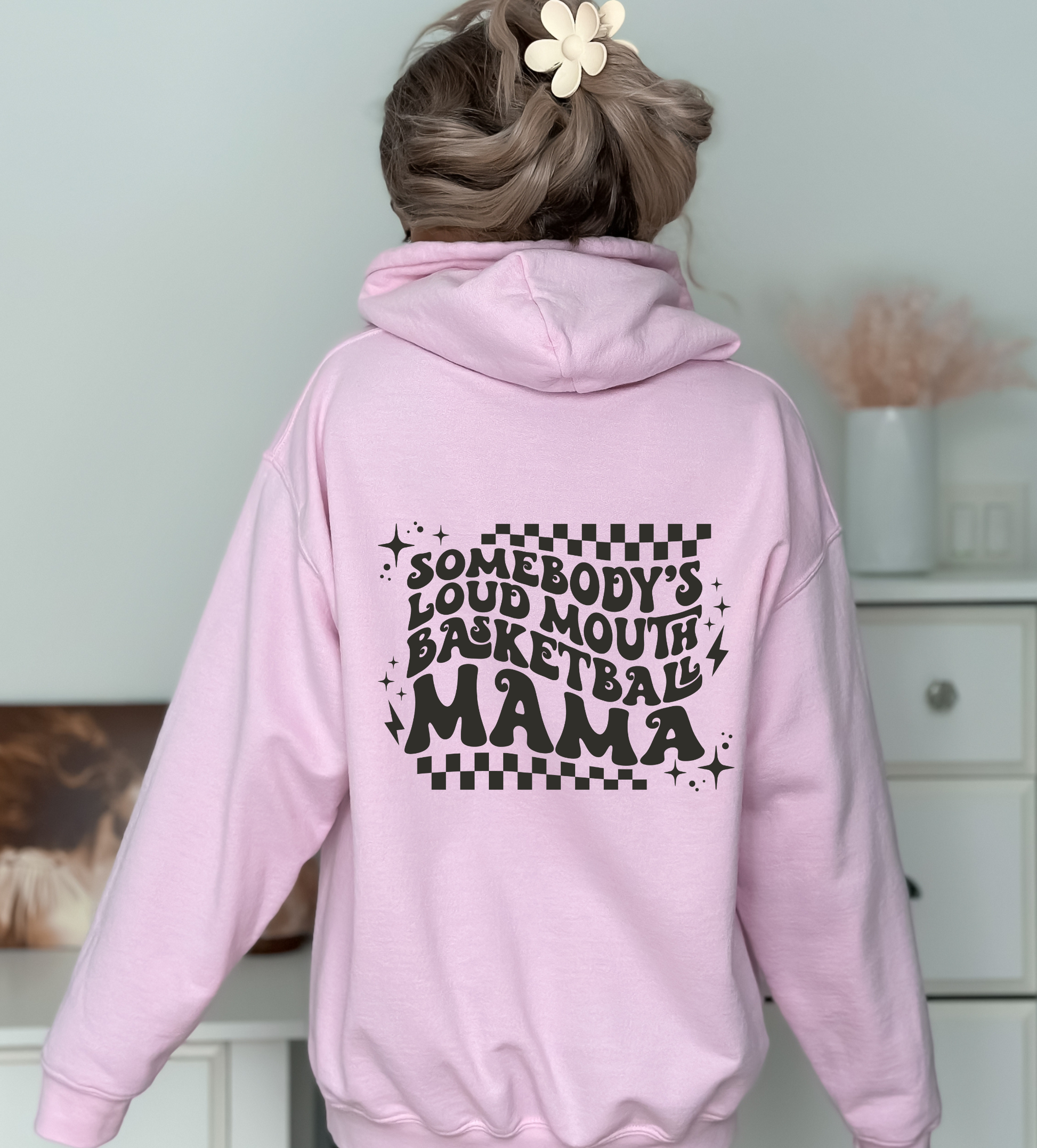 'Somebody's Loud Mouth Basketball Mama" hoodie sweatshirt. This sweatshirt is ideal for game day, offering comfort and style for basketball moms supporting their players.