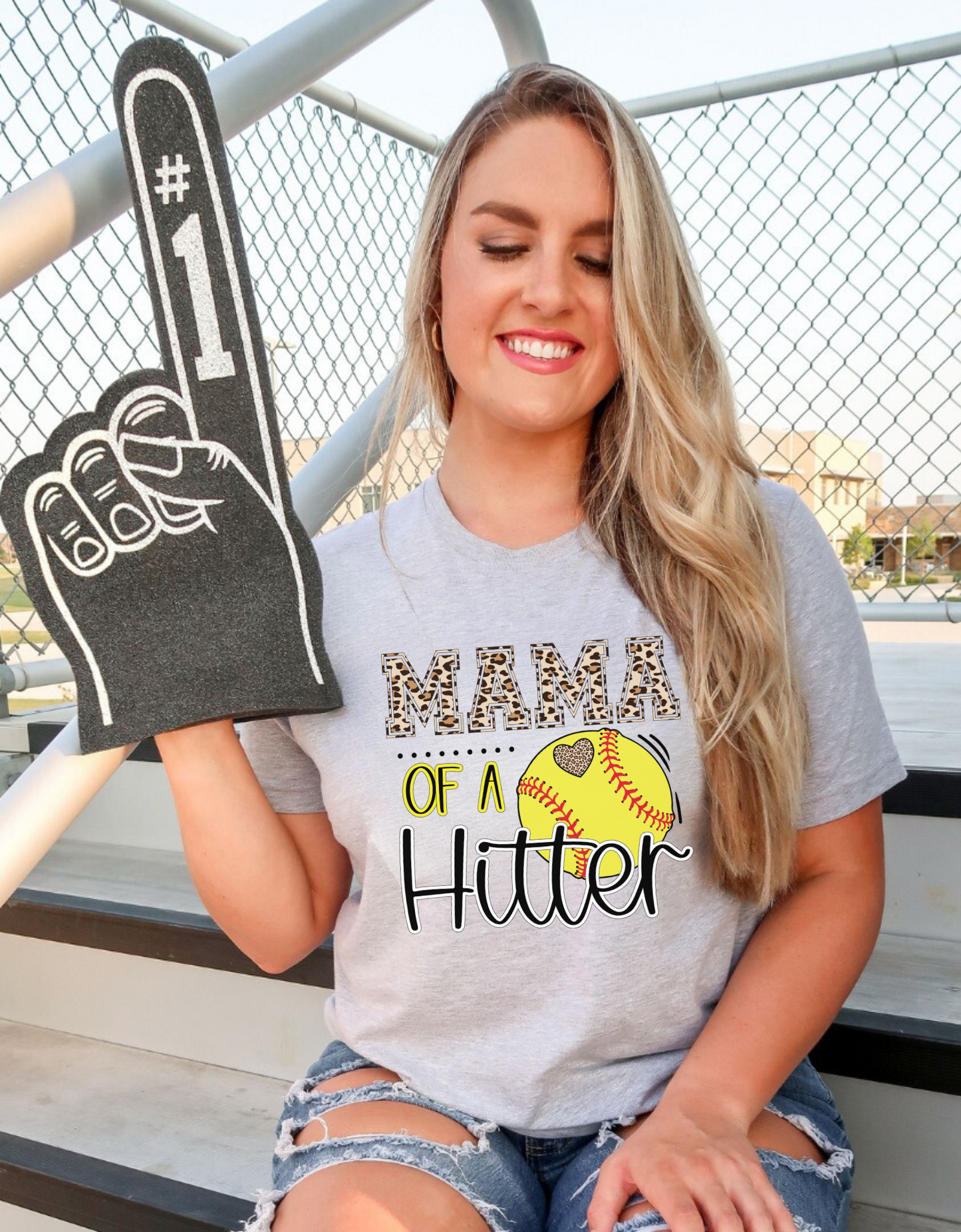 Mama of a Hitter, a trendy softball mom shirt that is perfect for softball game day!