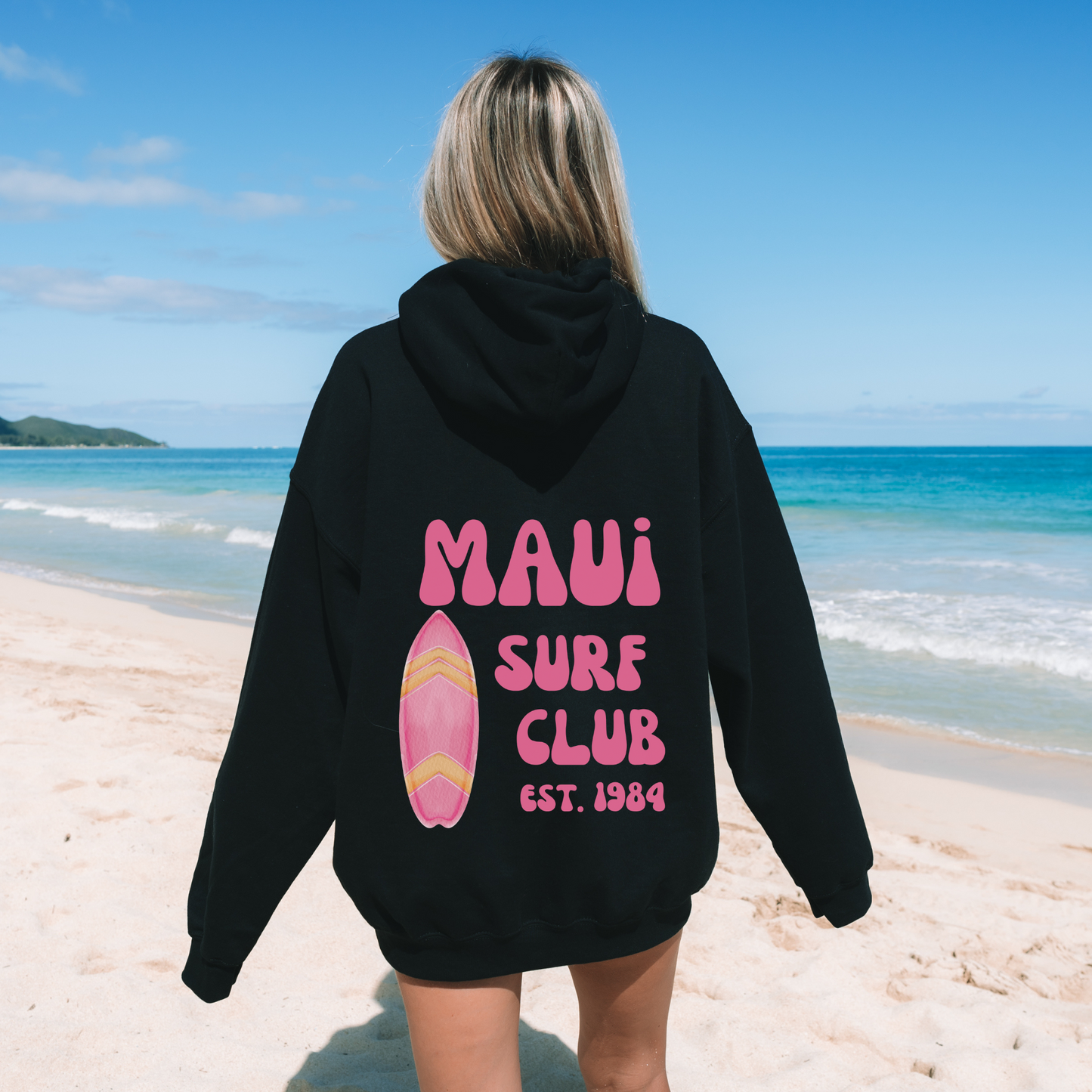  Oversized beach hoodie sweatshirt for women with "Maui Surf Club" on the back, perfect for a summer beach day outfit.