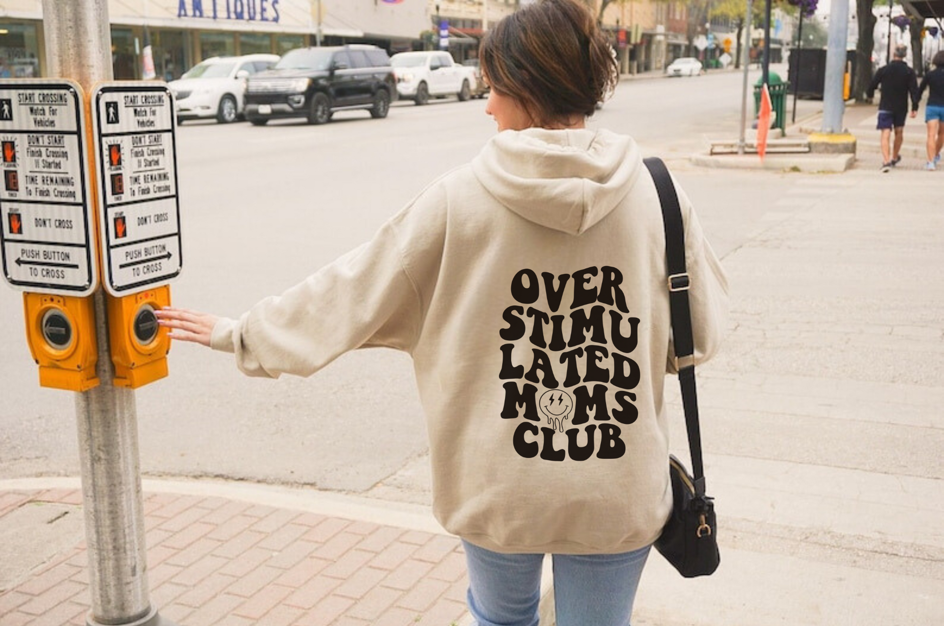 Funny 'Overstimulated Moms Club' hoodie sweatshirt for women with bold text design