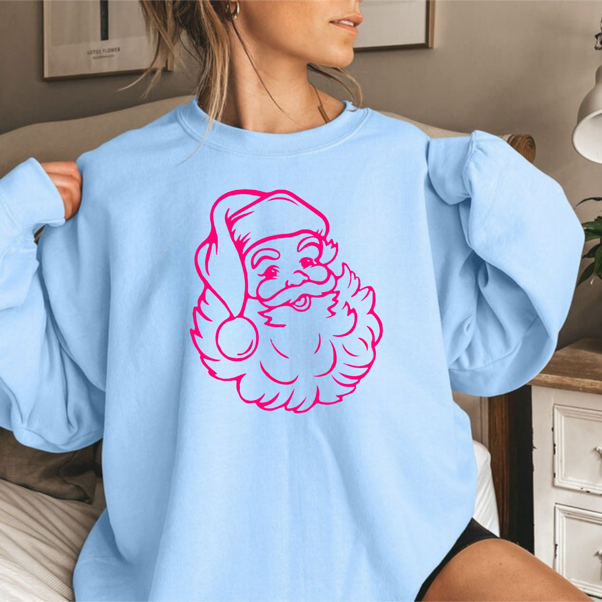 Cozy pink crewneck sweatshirt with preppy Santa design, suitable for holiday events and everyday winter style.