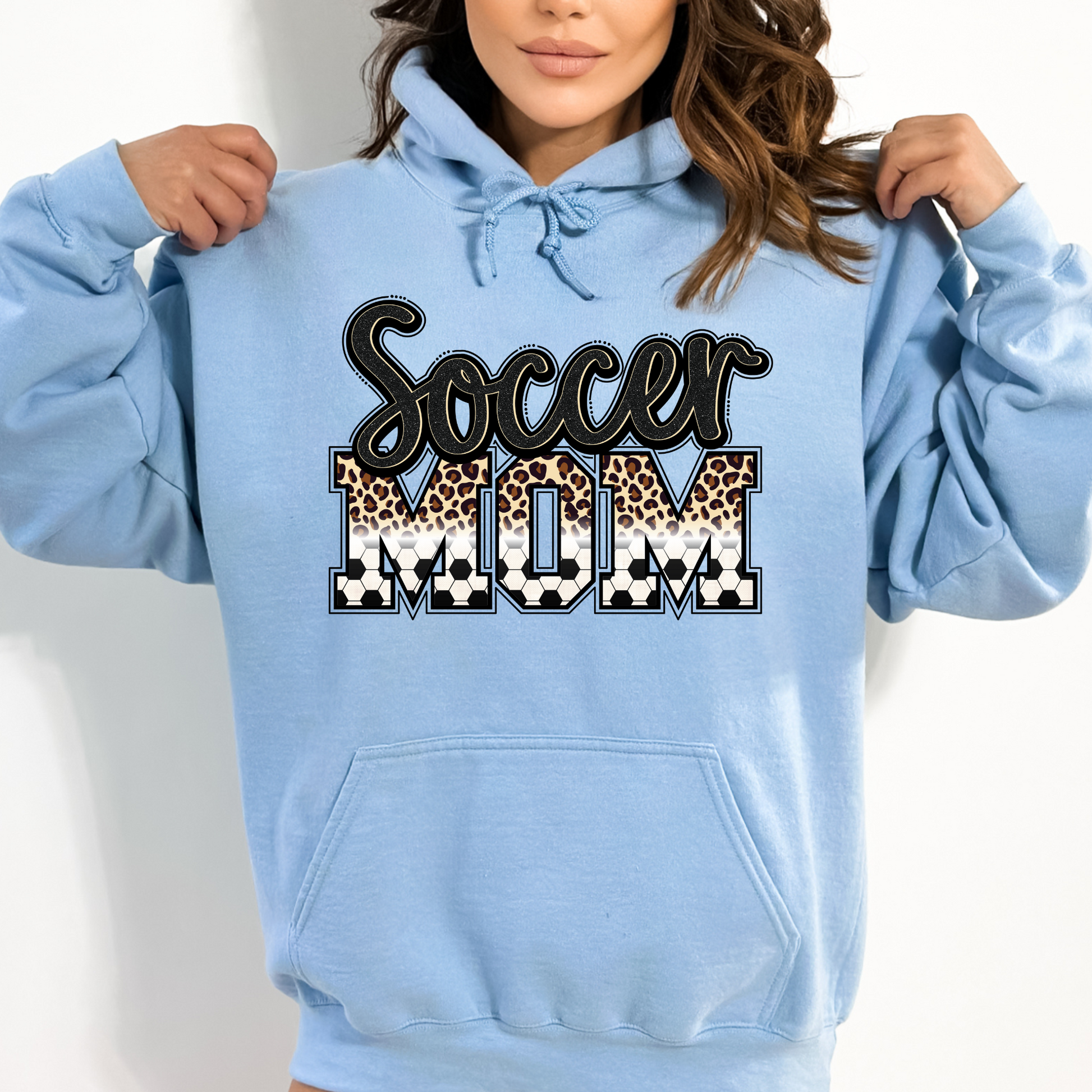 Cozy soccer mom hoodie sweatshirt - Stay warm and comfortable while supporting your soccer player at the games. Perfect for stylishly cheering on your athlete as a soccer mama.