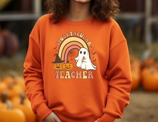 A cozy Halloween teacher sweatshirt, perfect for embracing the seasonal spirit while maintaining a professional teacher style. The sweatshirt features Halloween-themed design elements that add a touch of festive charm to your fall teacher outfit.