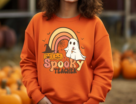 A cozy Halloween teacher sweatshirt, perfect for embracing the seasonal spirit while maintaining a professional teacher style. The sweatshirt features Halloween-themed design elements that add a touch of festive charm to your fall teacher outfit.