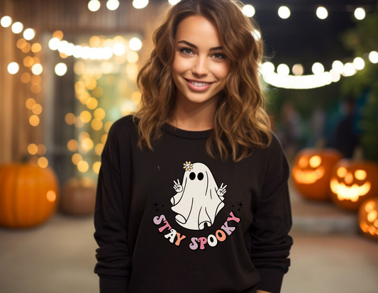 Our Retro Vintage Halloween Sweatshirt Crewneck with a cute hippie ghost design and "Stay Spooky" slogan is perfect for any Halloween enthusiast. Made with high-quality materials, this comfortable crewneck sweatshirt is durable and built to last. This sweatshirt is also a great gift for birthdays, holidays, or any special occasion. Show off your spooky side and add a touch of retro Halloween style to your wardrobe. Shop now and embrace the Halloween spirit!