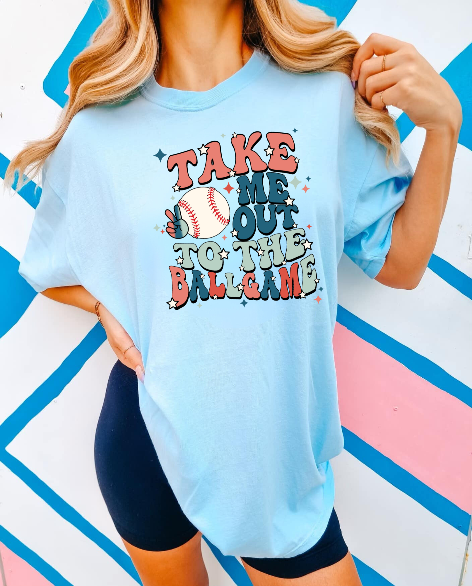 Retro Baseball Shirt with the phrase 'Take me out to the ballgame'. A trendy and cute graphic tee for baseball game days and baseball moms. Perfect for showcasing team spirit with a vintage flair