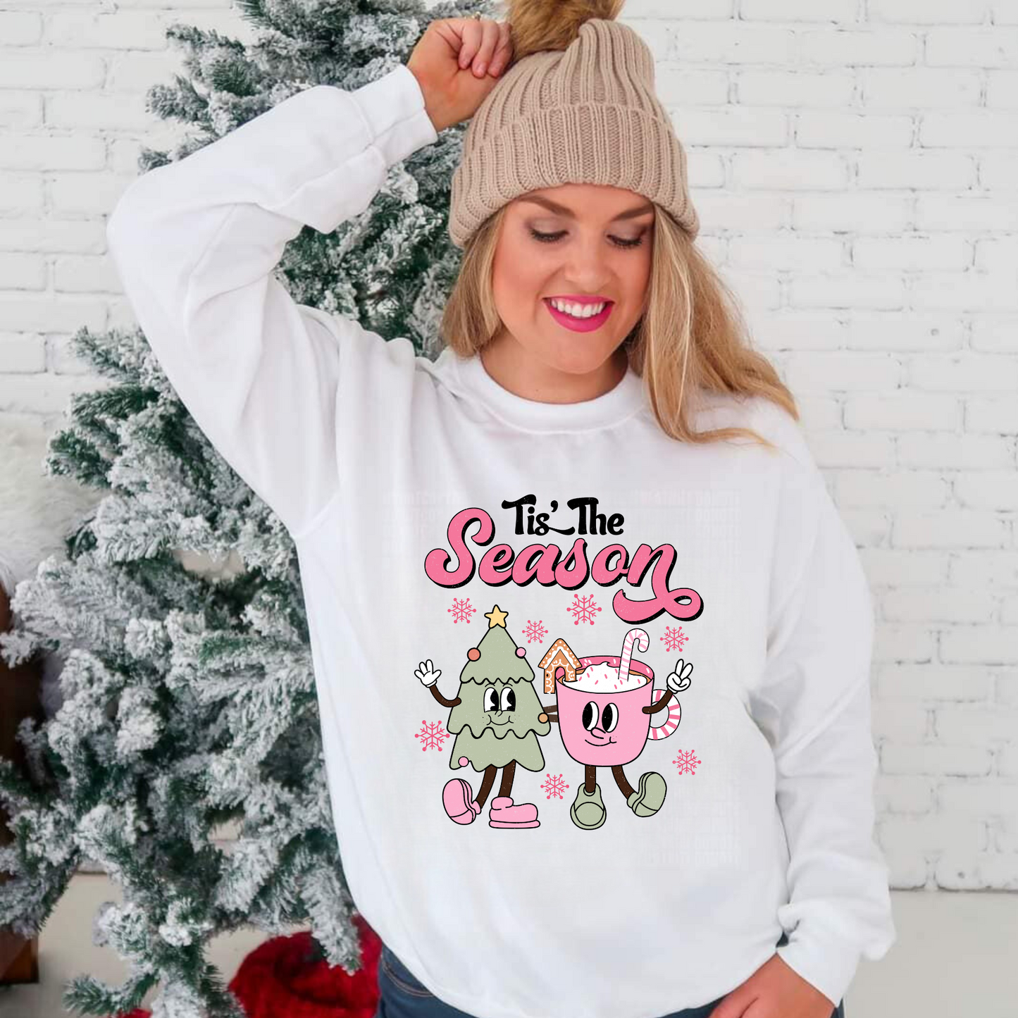 Get into the holiday spirit with our retro-inspired 'Tis the Season pink Christmas crewneck. This oversized, vintage design is perfect for your trendy winter outfit. Stay cozy while sipping Christmas coffee in style! Shop now.