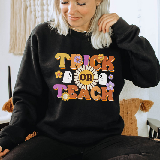 "Trick or Teach" Halloween teacher sweatshirt with a fun Halloween-themed design.