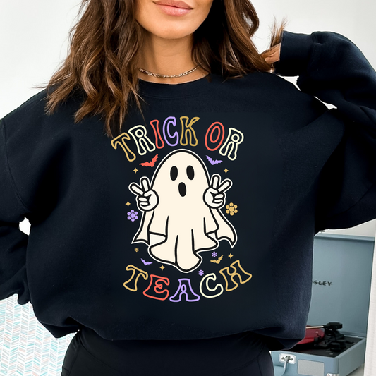 "Trick or Teach" Halloween teacher sweatshirt with a fun Halloween-themed design.