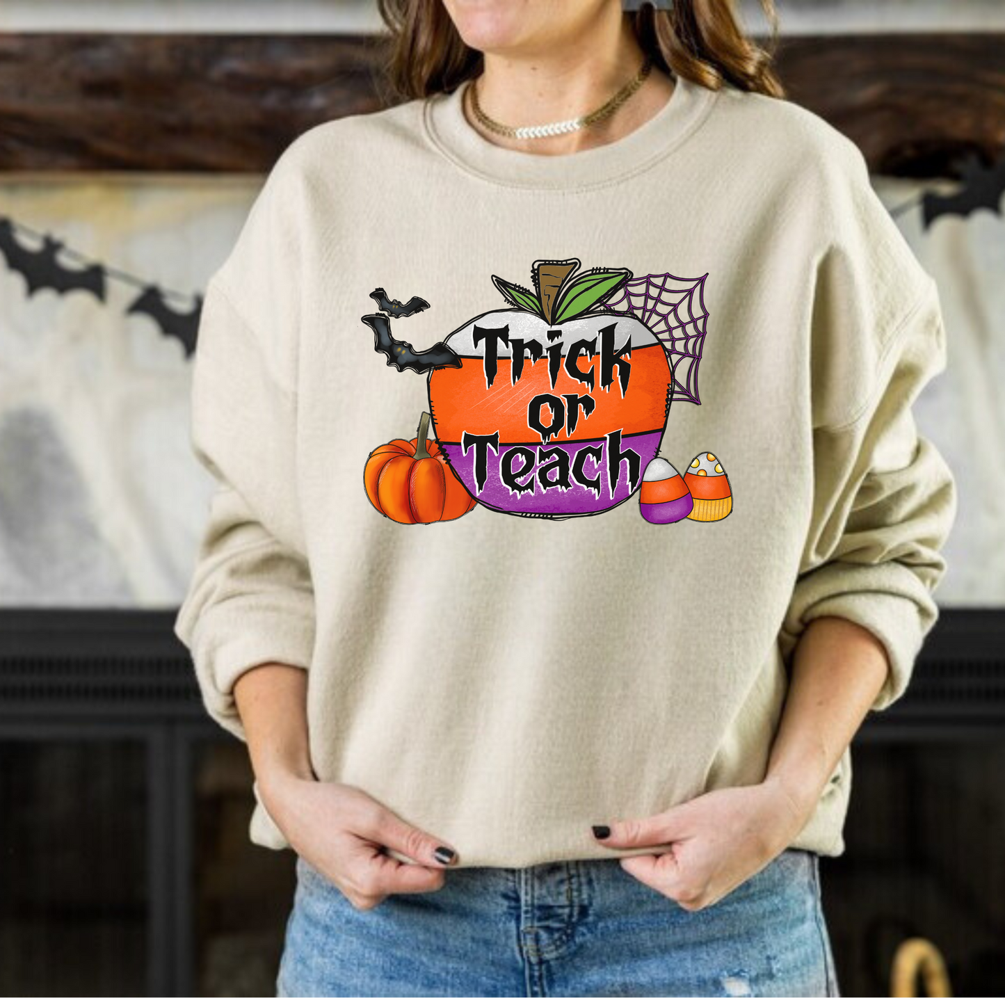 "Trick or Teach" Halloween teacher sweatshirt with a fun Halloween-themed design.