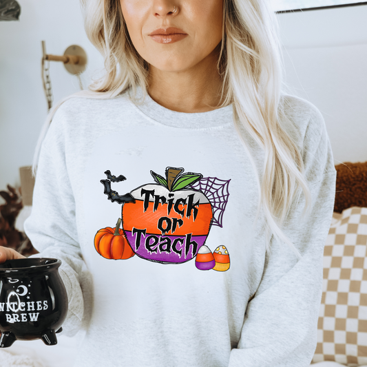 "Trick or Teach" Halloween teacher sweatshirt with a fun Halloween-themed design.