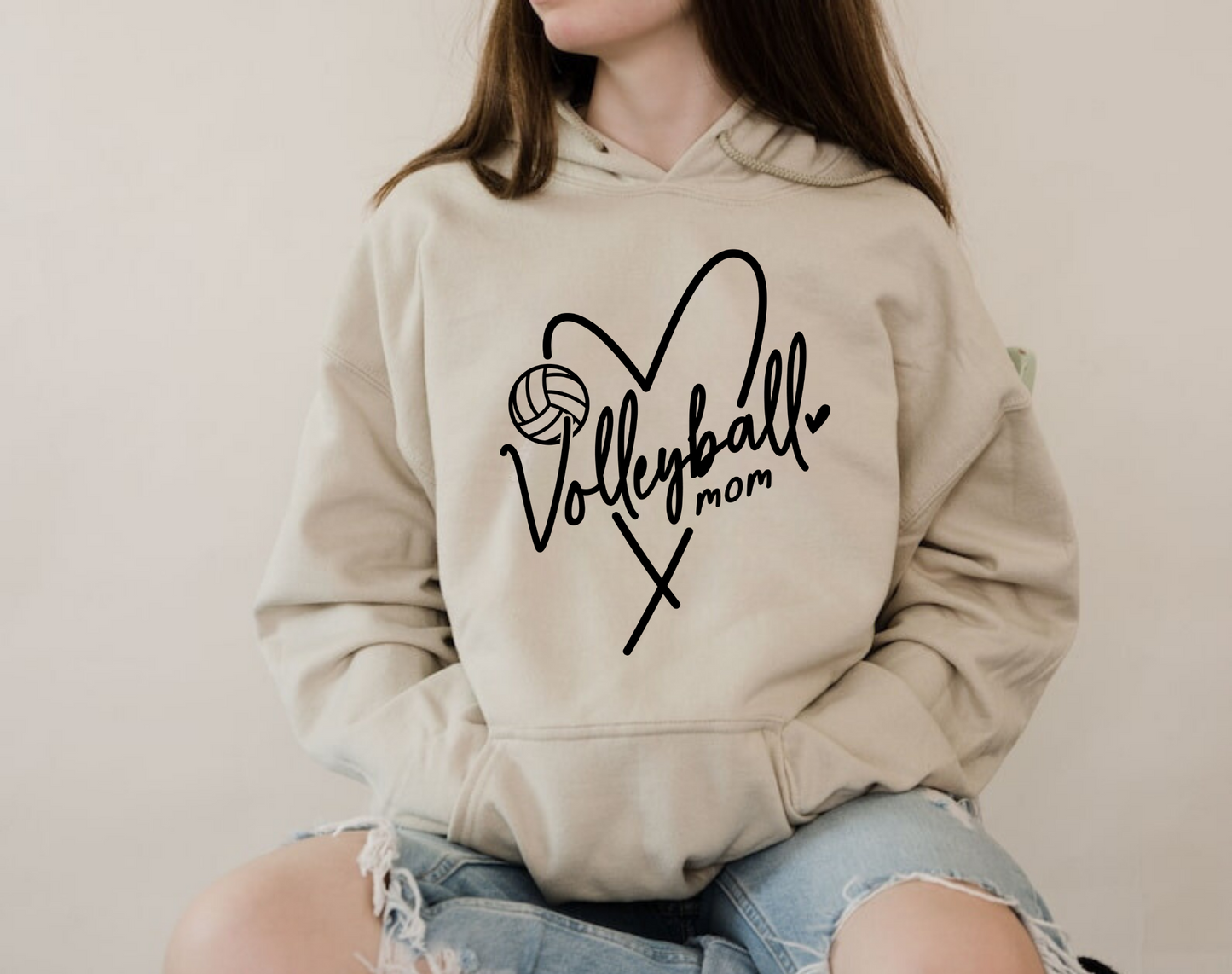 Cozy volleyball mom hoodie sweatshirt - Show your support in comfort with this essential hoodie perfect for volleyball games. Stay cozy and stylish as a proud volleyball mama.