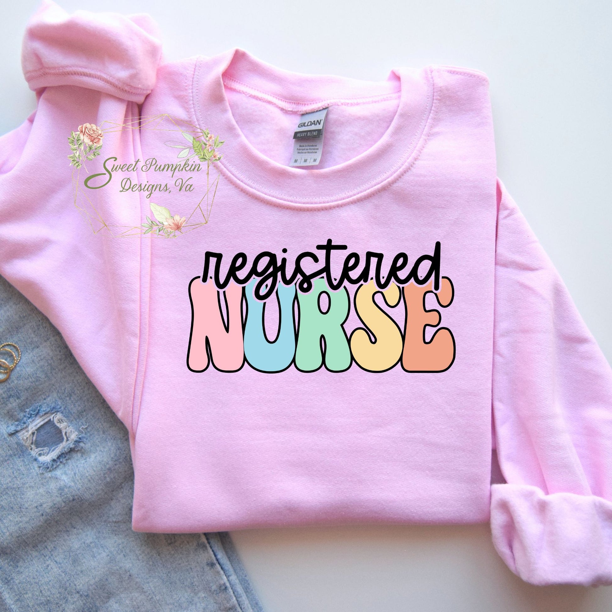 Retro Rainbow Registered Nurse Crewneck Sweatshirt - Cute and cozy nurse apparel with a vintage-inspired font in rainbow colors